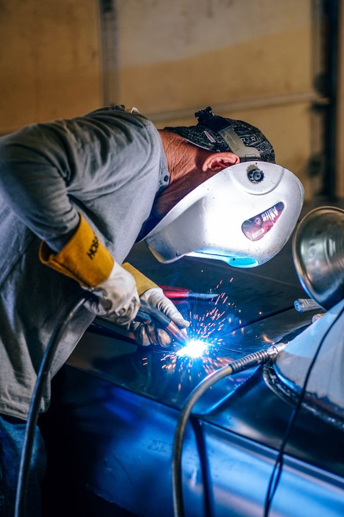 Adult Welding on Car